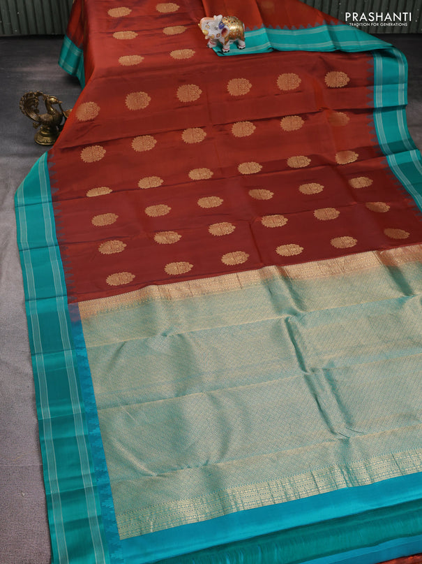 Pure kanchipuram silk saree rust shade and teal green with zari woven buttas and temple design woven border