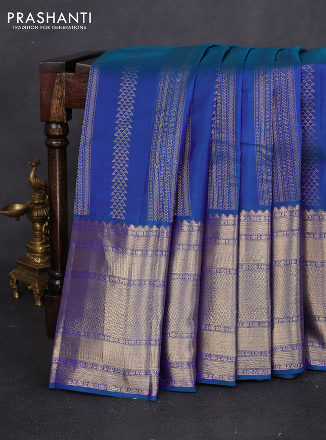 Pure kanchipuram silk saree dual shade of bluish green and pastel pink with allover zari weaves and long rich zari woven border