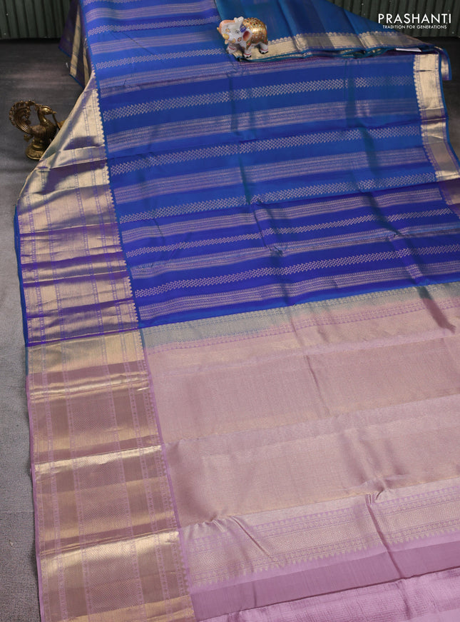 Pure kanchipuram silk saree dual shade of bluish green and pastel pink with allover zari weaves and long rich zari woven border