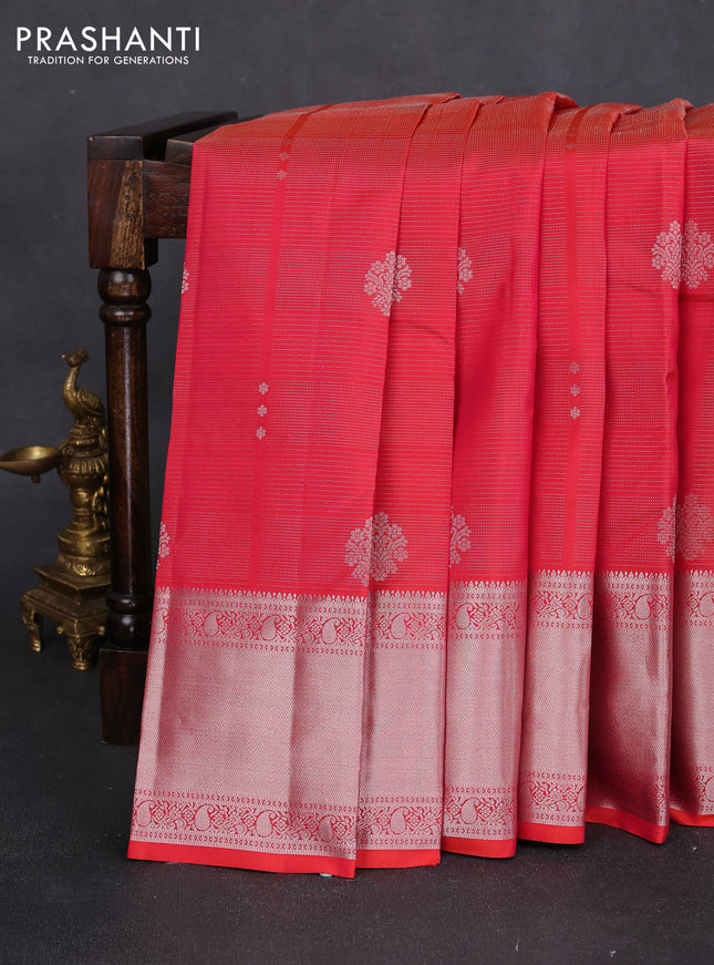 Pure kanchipuram silk saree dual shade of pinkish orange with allover silver zari weaves & buttas and long silver zari woven border
