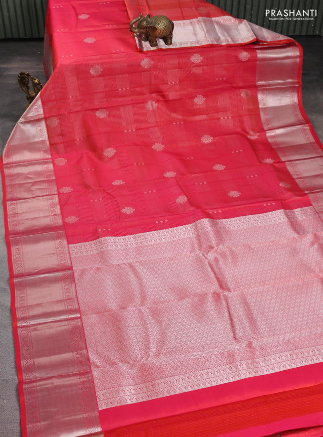 Pure kanchipuram silk saree dual shade of pinkish orange with allover silver zari weaves & buttas and long silver zari woven border