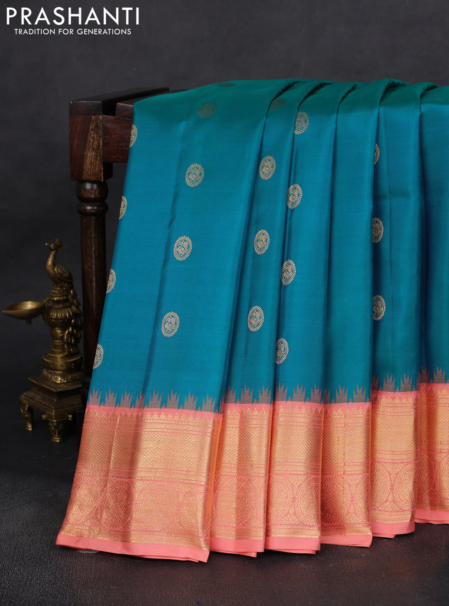 Pure gadwal silk saree dual shade of bluish green and peach shade with zari woven annam buttas and temple design zari woven border