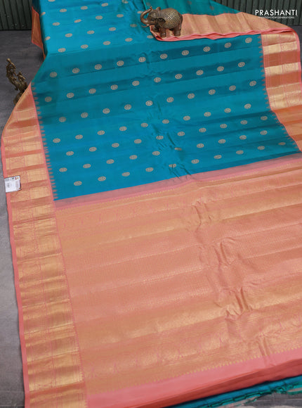 Pure gadwal silk saree dual shade of bluish green and peach shade with zari woven annam buttas and temple design zari woven border
