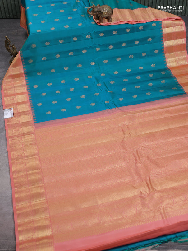 Pure gadwal silk saree dual shade of bluish green and peach shade with zari woven annam buttas and temple design zari woven border