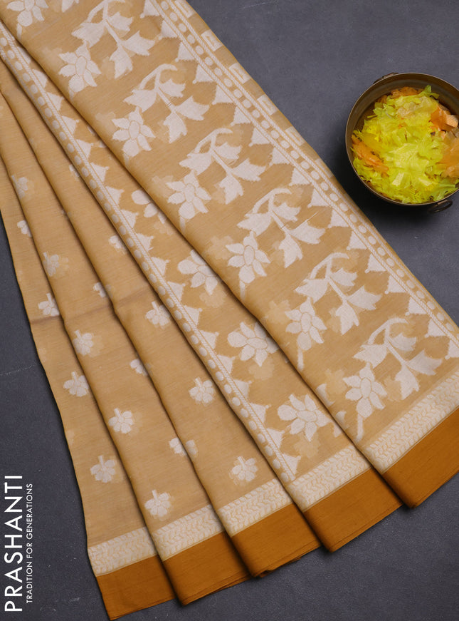 Khadi cotton saree sandal and dark mustard with allover floral thread woven buttas and thread woven border