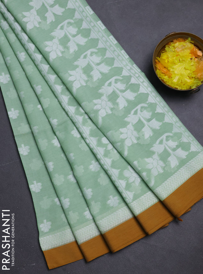 Khadi cotton saree pista green and dark mustard with allover floral thread woven buttas and thread woven border