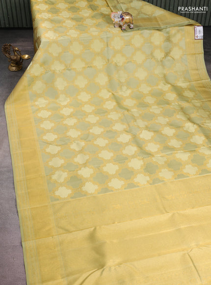 Pure kanchipuram silk saree mild pista green with allover zari weaves and rich zari woven border