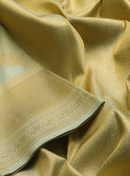 Pure kanchipuram silk saree mild pista green with allover zari weaves and rich zari woven border