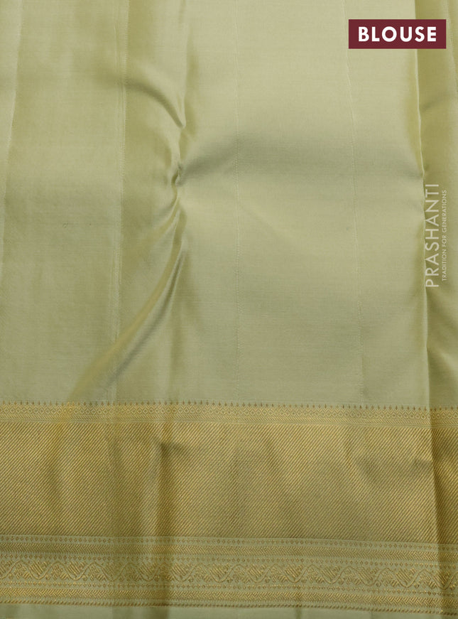 Pure kanchipuram silk saree mild pista green with allover zari weaves and rich zari woven border