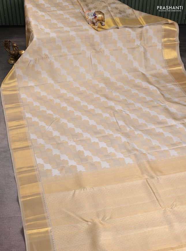 Pure kanchipuram silk saree cream and beige with allover zari woven brocade weaves and rich zari woven border