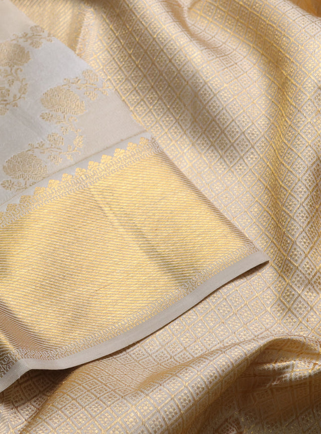 Pure kanchipuram silk saree cream and beige with allover zari woven brocade weaves and rich zari woven border