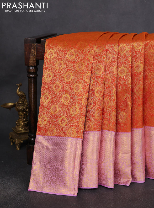 Pure kanchipuram silk saree orange and mild lavender with allover zari woven brocade weaves and rich zari woven border