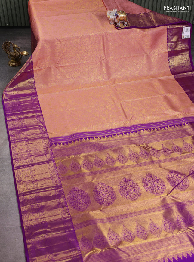 Pure kanchipuram silk saree peach shade and purple with allover zari woven brocade weaves and long rich zari woven border