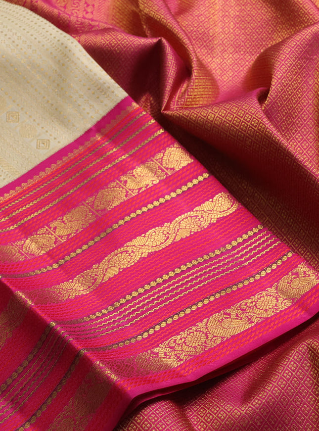 Pure kanchipuram silk saree sandal and pink with allover zari woven brocade weaves and long rich zari woven border