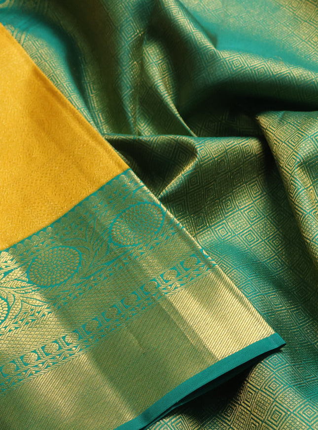 Pure kanchipuram silk saree mango yellow and green with allover zari woven brocade weaves and rich zari woven border