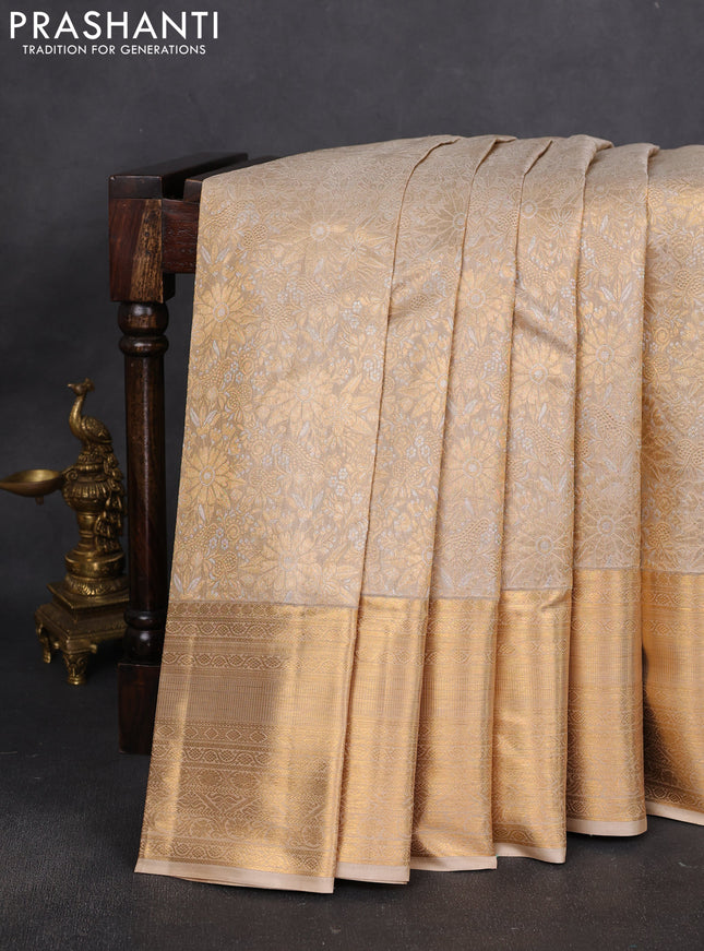 Pure kanchipuram silk saree beige with allover silver & gold zari woven brocade weaves and long rich zari woven border