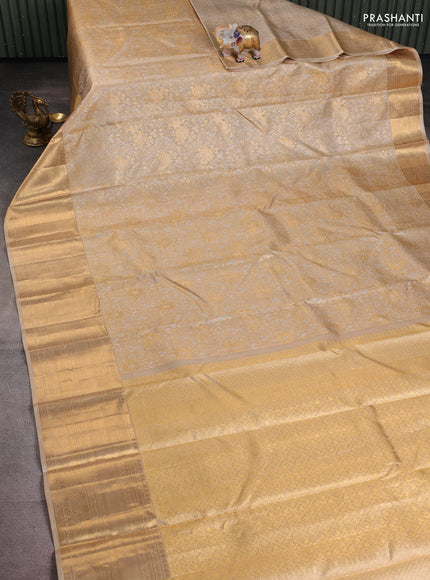 Pure kanchipuram silk saree beige with allover silver & gold zari woven brocade weaves and long rich zari woven border