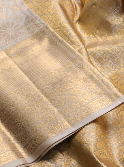Pure kanchipuram silk saree beige with allover silver & gold zari woven brocade weaves and long rich zari woven border