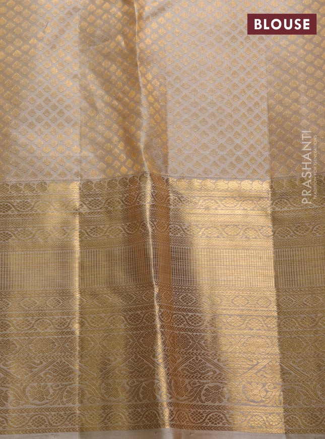 Pure kanchipuram silk saree beige with allover silver & gold zari woven brocade weaves and long rich zari woven border