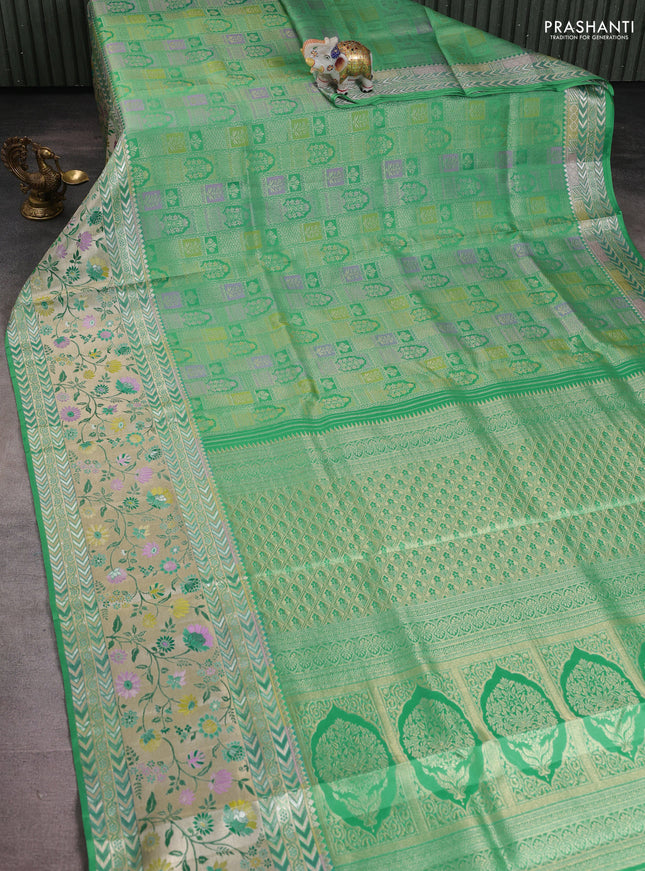 Pure kanchipuram silk saree teal green with allover zari woven brocade weaves and long rich floral zari woven border