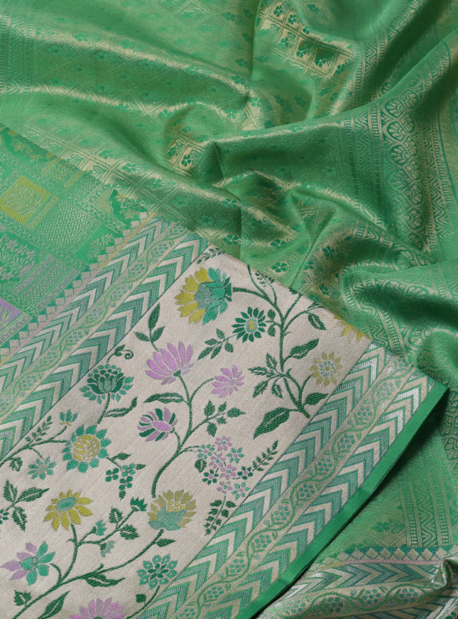Pure kanchipuram silk saree teal green with allover zari woven brocade weaves and long rich floral zari woven border