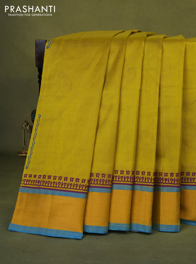 Silk cotton block printed saree lime yellow and cs blue with allover prints and zari woven border