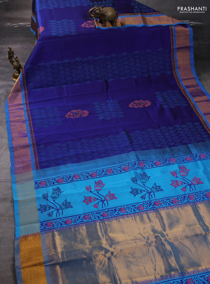 Silk cotton block printed saree blue and cs blue with allover prints and zari woven border