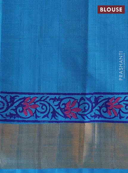 Silk cotton block printed saree blue and cs blue with allover prints and zari woven border