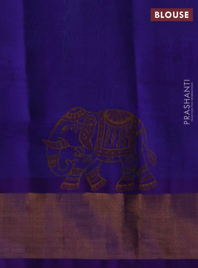 Silk cotton block printed saree dual shade of teal bluish green and violet with allover prints and zari woven border