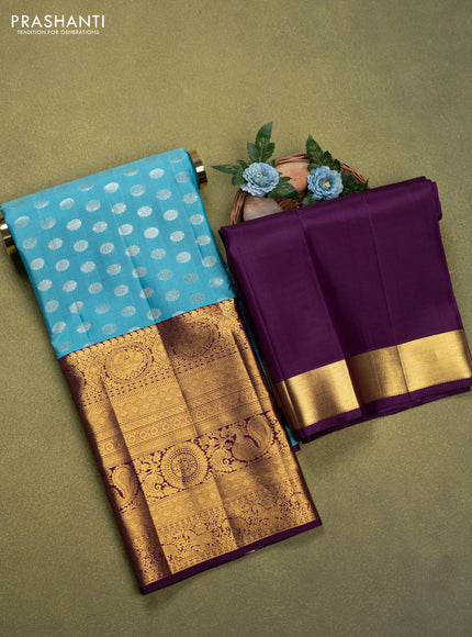 Pure silk lehenga dhawani light blue and deep purple with allover silver zari woven buttas and long rich zari woven border