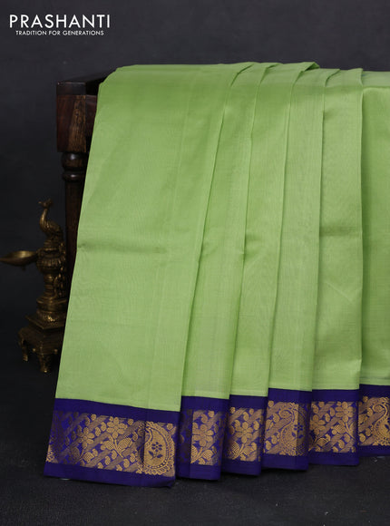 Silk cotton saree pista green and blue with plain body and zari woven korvai border