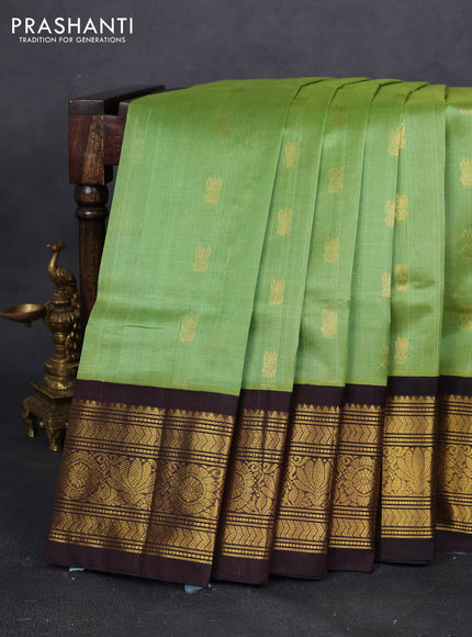 Silk cotton saree light green and coffee brown with zari woven buttas and zari woven korvai border