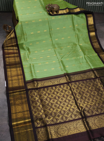 Silk cotton saree light green and coffee brown with zari woven buttas and zari woven korvai border