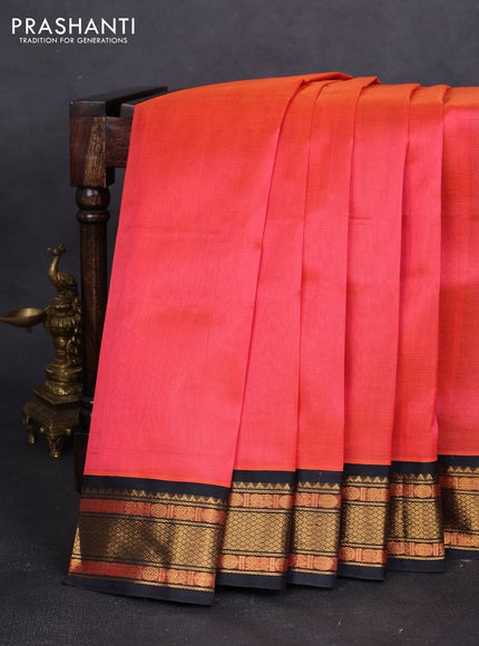 Silk cotton saree dual shade of pinkish orange and black with allover vairaosi pattern and zari woven korvai border