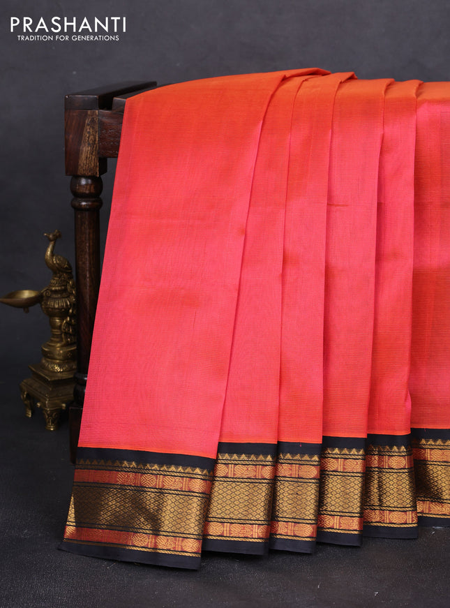 Silk cotton saree dual shade of pinkish orange and black with allover vairaosi pattern and zari woven korvai border