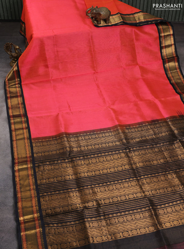 Silk cotton saree dual shade of pinkish orange and black with allover vairaosi pattern and zari woven korvai border