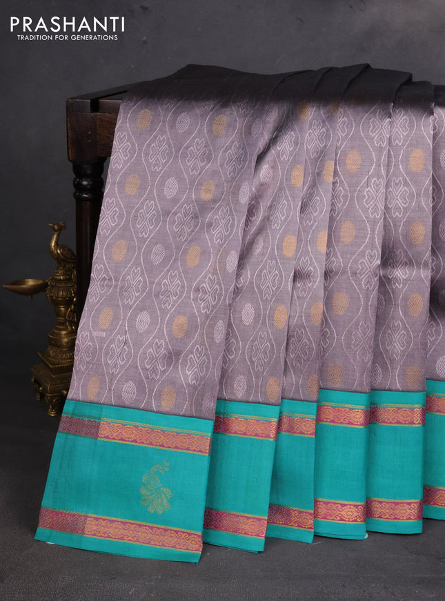 Silk cotton saree grey and teal green with allover self emboss & zari buttas and rettapet zari woven korvai border