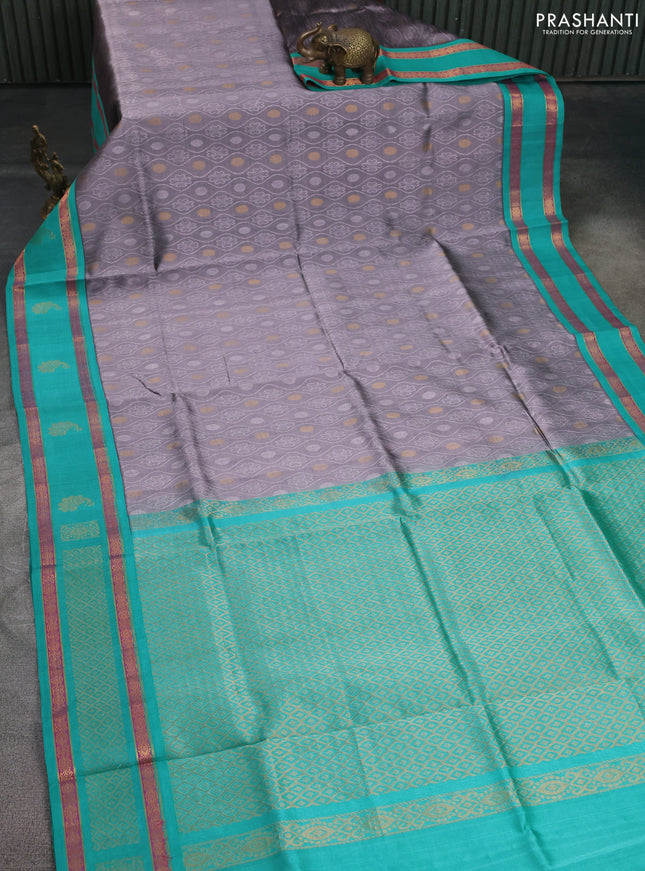 Silk cotton saree grey and teal green with allover self emboss & zari buttas and rettapet zari woven korvai border