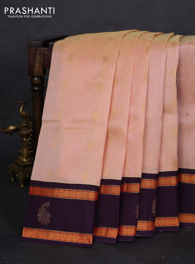 Silk cotton saree sandal and deep jamun with allover self emboss & zari buttas and rettapet zari woven korvai border