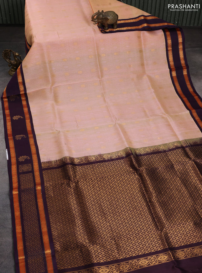 Silk cotton saree sandal and deep jamun with allover self emboss & zari buttas and rettapet zari woven korvai border