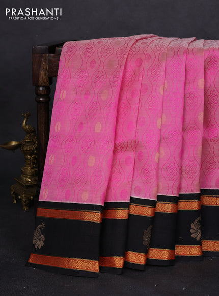 Silk cotton saree light pink and black with allover self emboss & zari buttas and rettapet zari woven korvai border