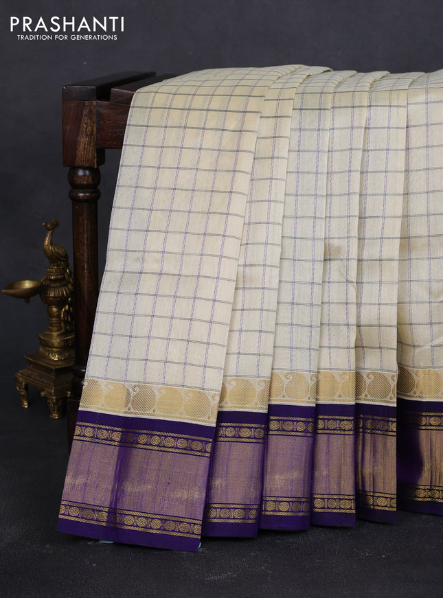 Silk cotton saree cream and blue with allover checked pattern and paisley rettapet zari woven korvai border