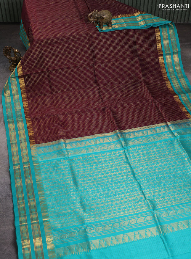 Silk cotton saree deep jamun shade and teal green with allover small checked pattern and temple rettapet zari woven korvai border