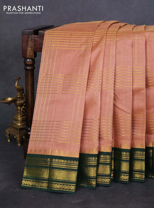 Silk cotton saree pastel peach and green with allover zari checked pattern and zari woven korvai border