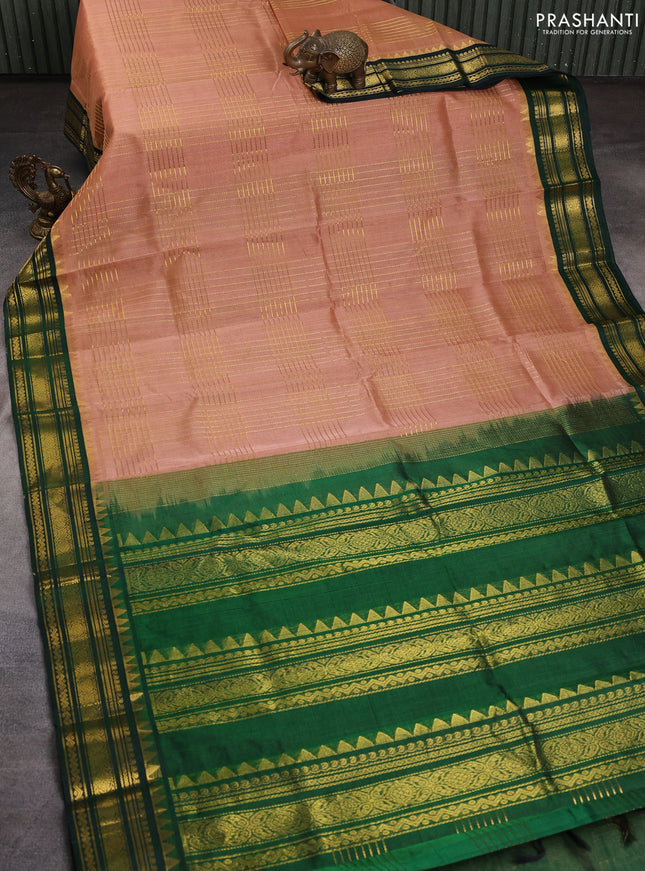 Silk cotton saree pastel peach and green with allover zari checked pattern and zari woven korvai border