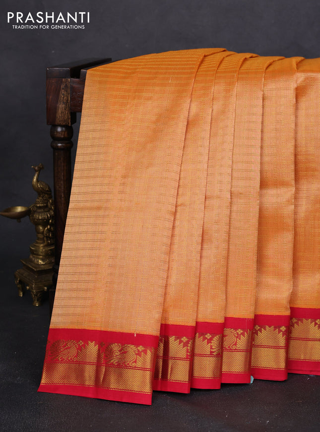 Silk cotton saree pale orange and red with allover zari woven checked pattern and zari woven korvai border
