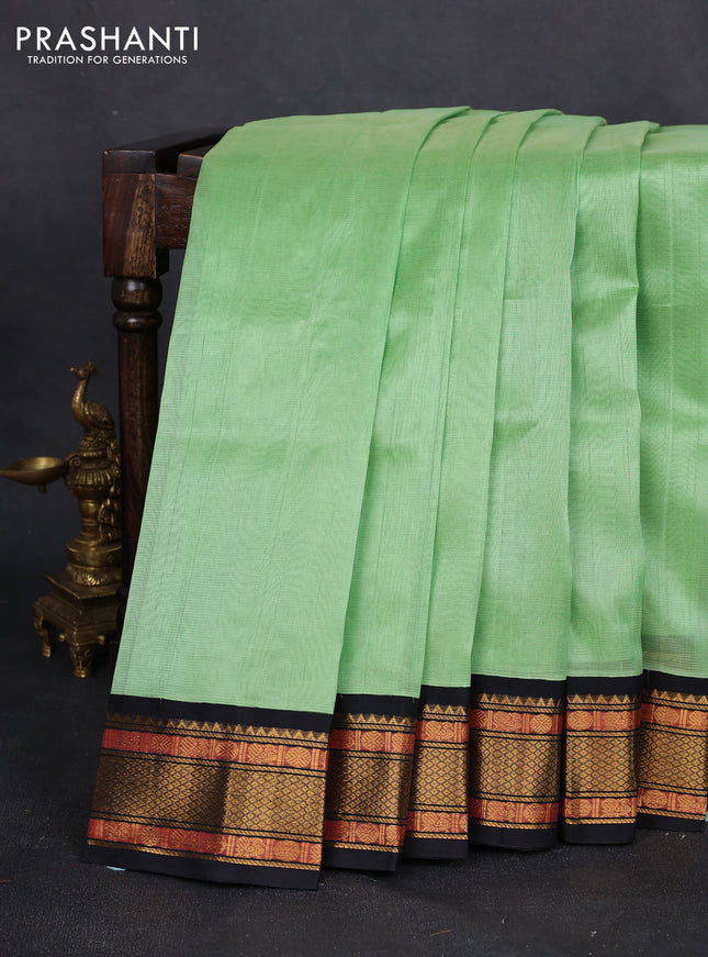 Silk cotton saree piata green and black with plain body and temple design zari woven border
