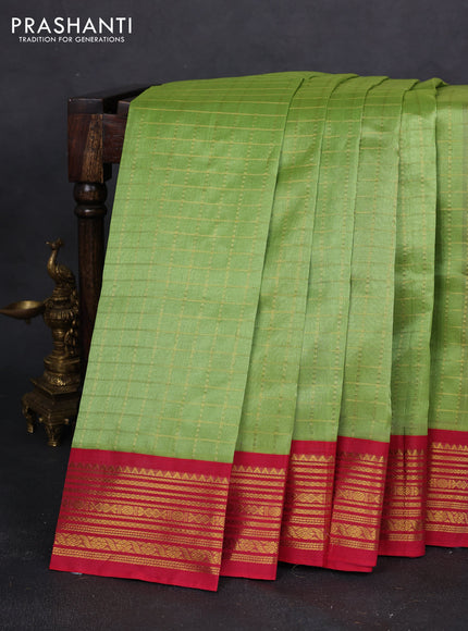 Silk cotton saree light green and pink with allover zari checked pattern and zari woven korvai border