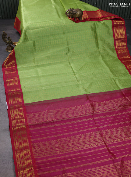 Silk cotton saree light green and pink with allover zari checked pattern and zari woven korvai border