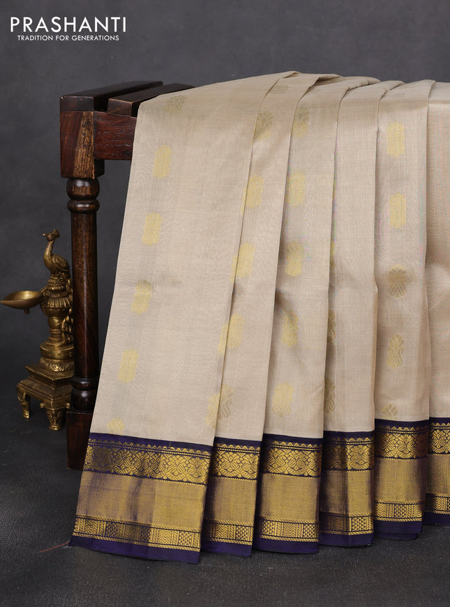 Kuppadam silk cotton saree beige and navy blue with zari woven buttas and zari woven border